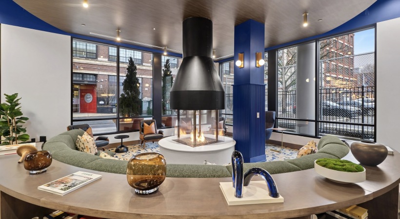 a lounge with a fireplace and a large couch