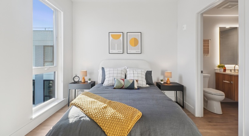 a bedroom with a bed and two nightstands